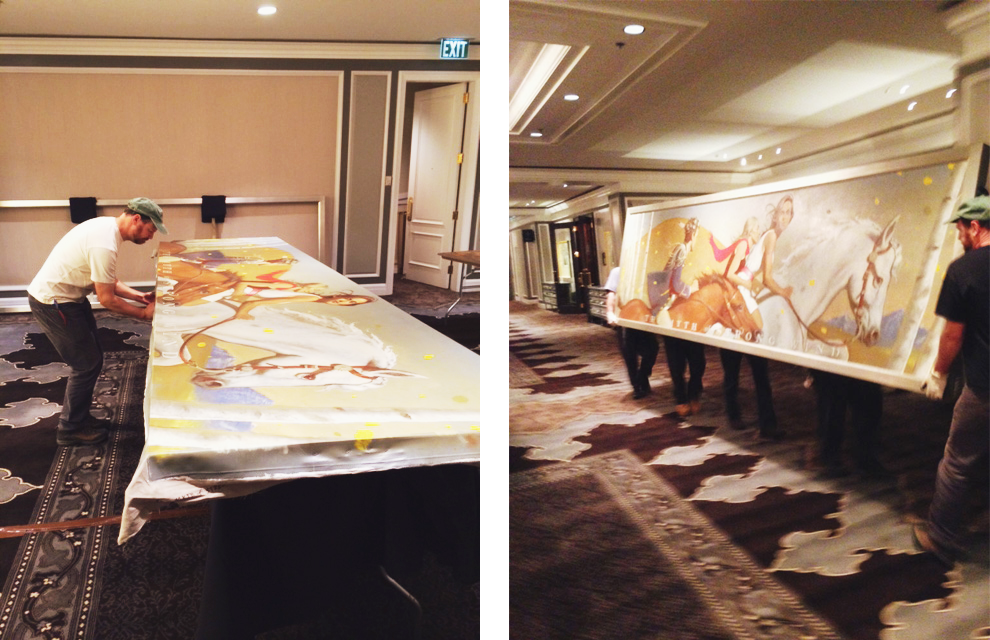 Allison and Ross stretching and installing a Bo Bartlett mural on canvas at the St. Regis in Aspen